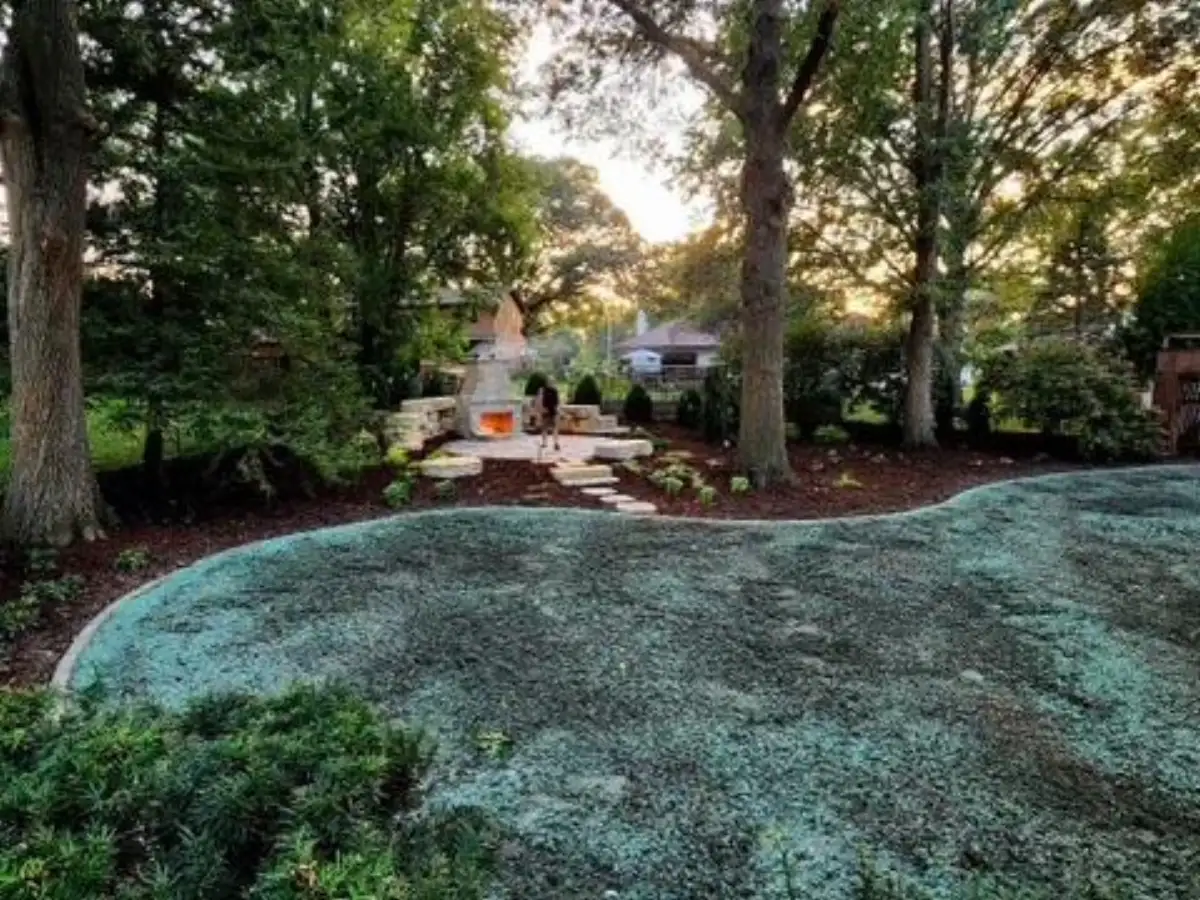 Outdoor stone fireplace on circular paver pad